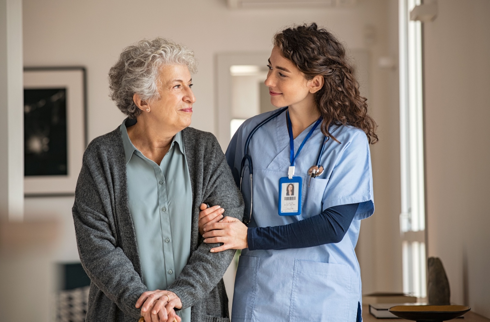 A senior woman with her nurse in skilled nursing care while she recovers from an injury